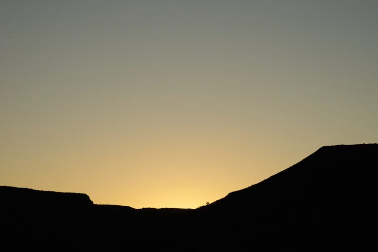 silhouette of mountain during sunset