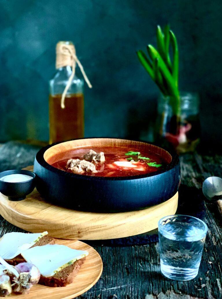 red soup in black ceramic bowl