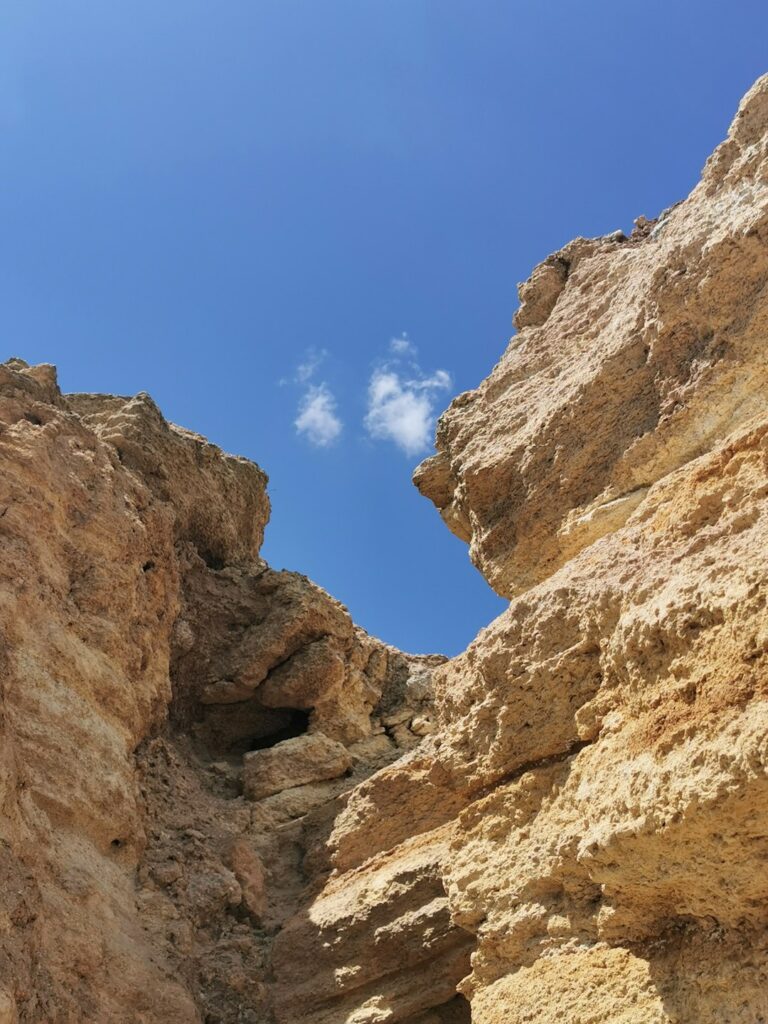 brown rocky mountain under blue sky during daytime