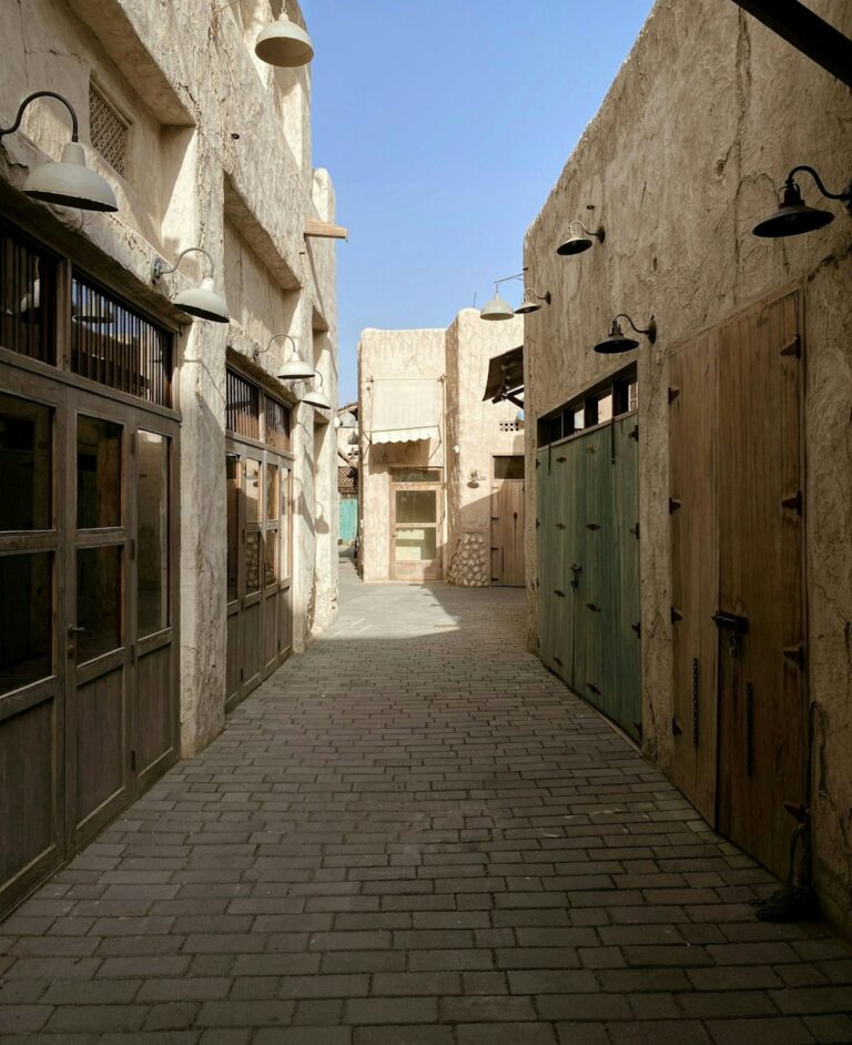 a cobblestone street between buildings