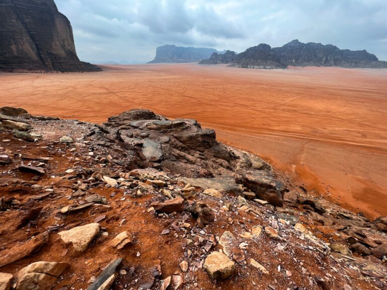 a rocky outcropping in the middle of a desert