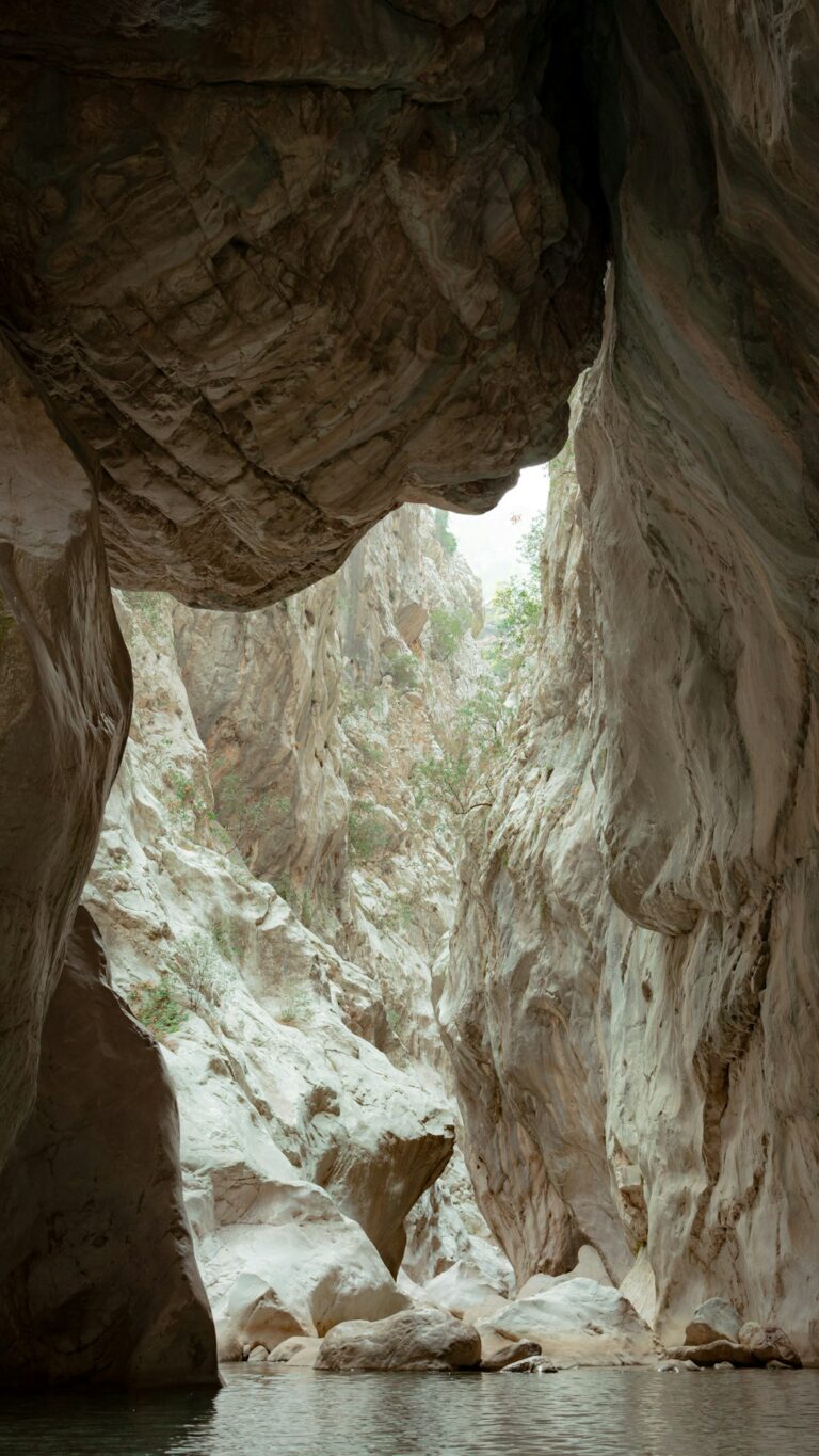 a person in a kayak in a cave