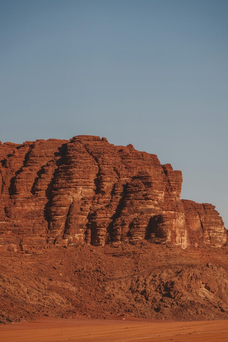 a large rock formation in the middle of a desert