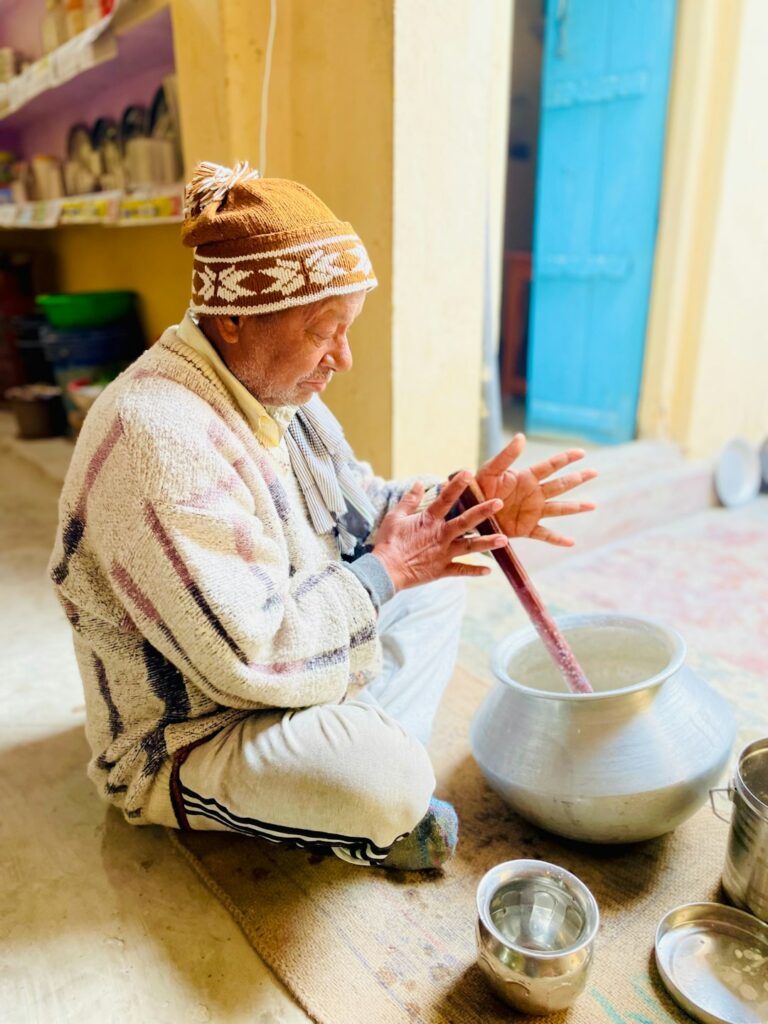 a person sitting on the floor with a bowl