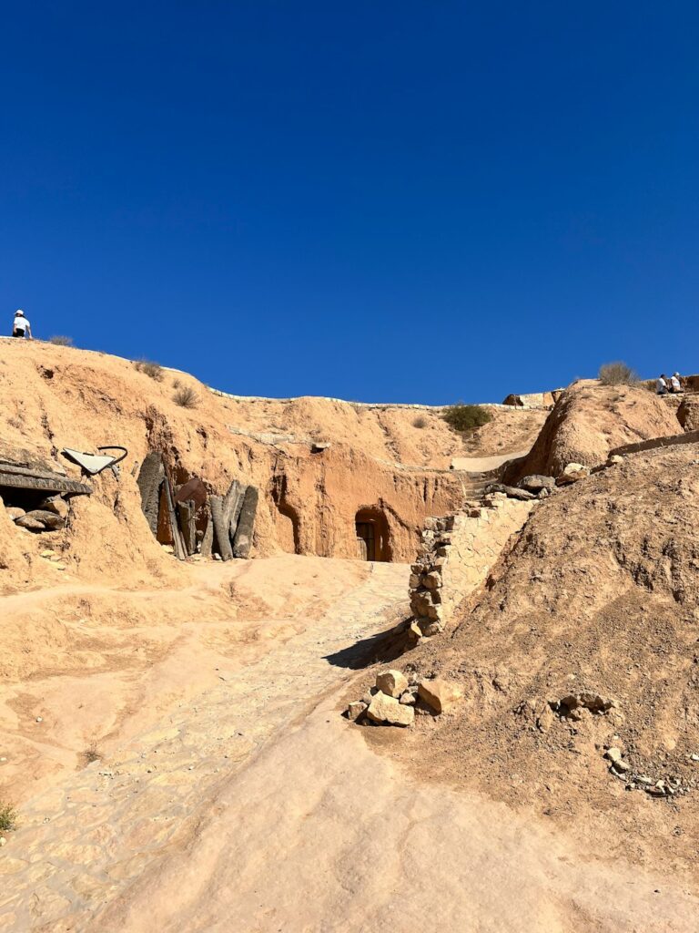 a dirt road in the middle of a desert