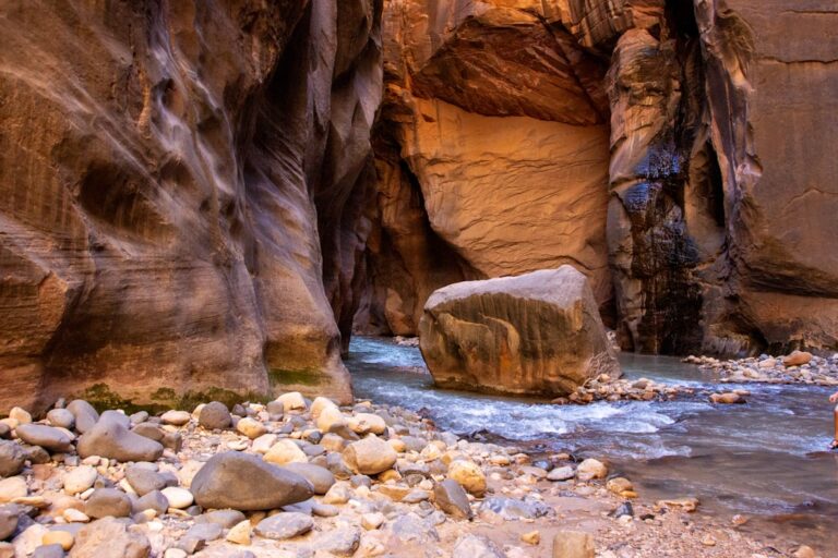 A river running through a narrow canyon filled with rocks