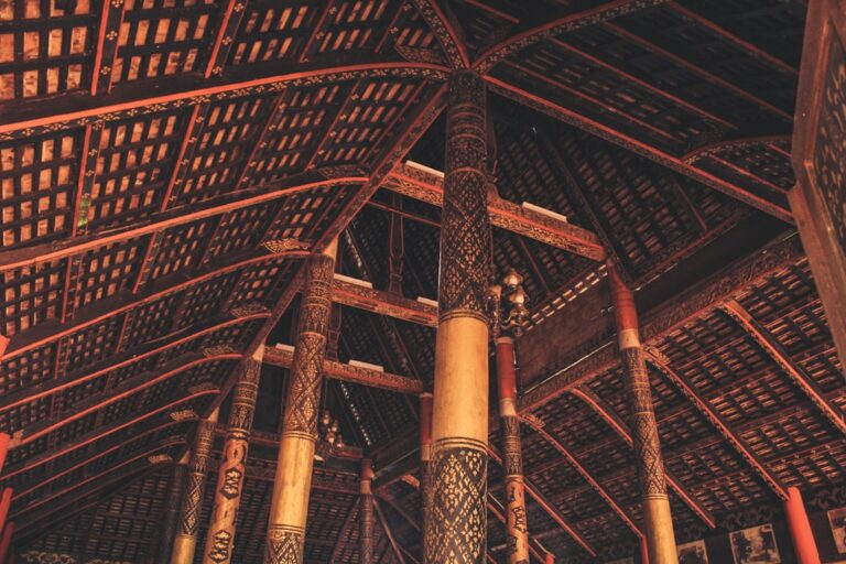 A large wooden structure with columns and a ceiling