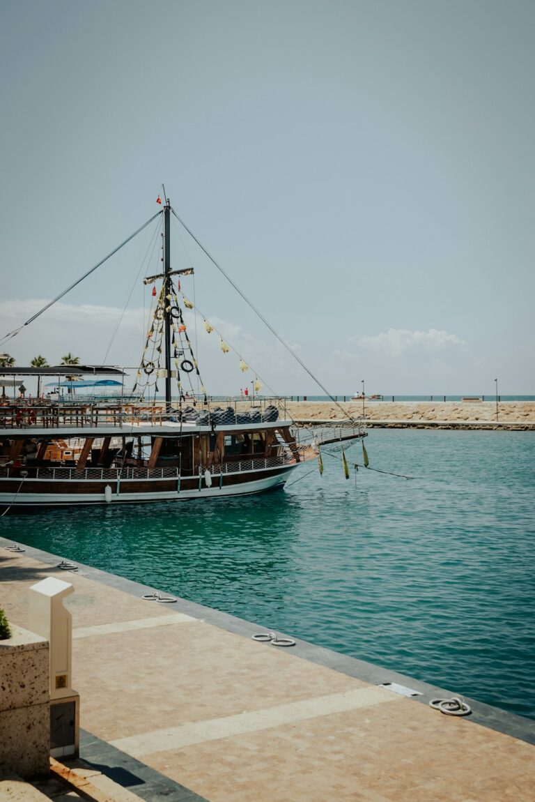 A boat is docked in clear turquoise water.