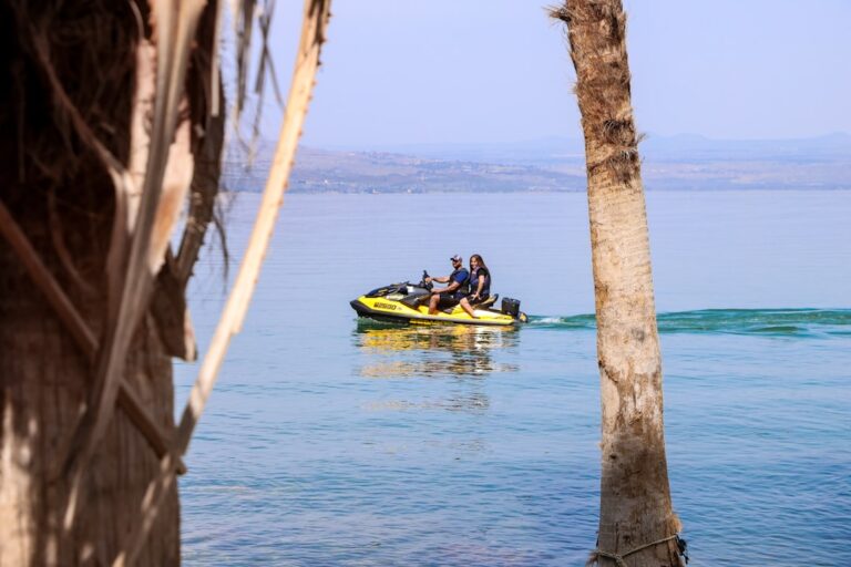 People enjoy a jet ski ride on the water.