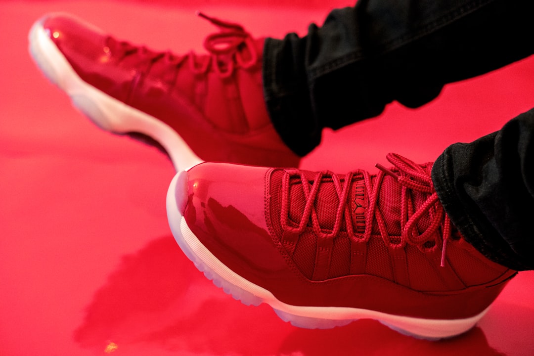 red and white nike athletic shoes