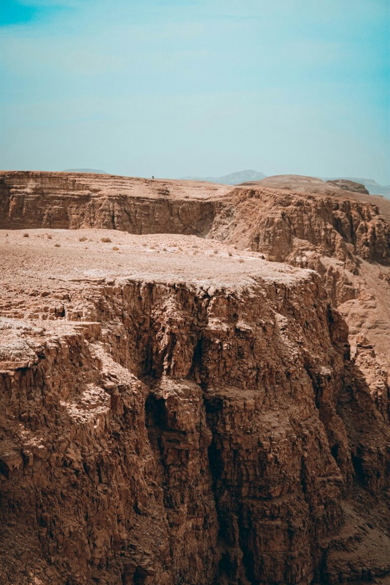 brown rocky mountain under blue sky during daytime