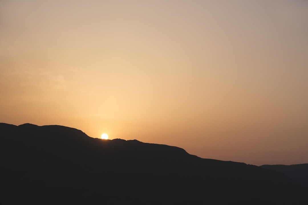 silhouette of mountain during sunset